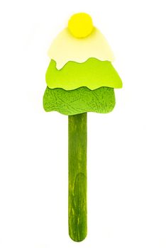 cute christmas hand made craft. green christmas tree popsicle stick bookmark. merry christmas and happy new year concept