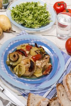 Traditional portuguese meal done in the oven, codfish with potatoes in olive oil.