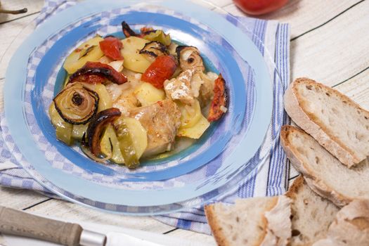 Traditional portuguese meal done in the oven, codfish with potatoes in olive oil.