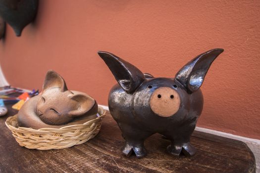 Ceramic souvenir pig and cat from Monchique village, Portugal.