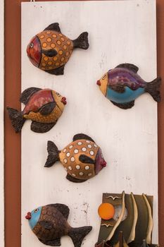 Colorful souvenir ceramic fish from Monchique village, Portugal.