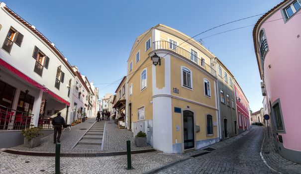 View of the typical architecture buildings from Monchique village with tourist shops and cobblestone streets.