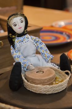 Souvenir doll of a Portuguese character, lady with corn crushing stone.