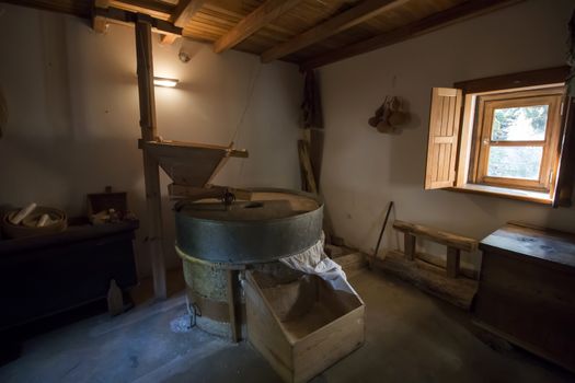 Old vintage furniture and griding wheel for corn.