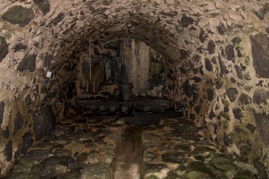 View of an old water mill wheel.