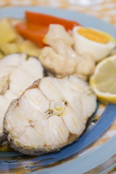 Typical portuguese meal with hake fish with cauliflower, carrots and potatoes.