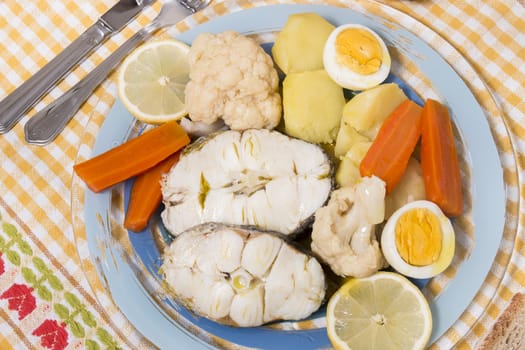 Typical portuguese meal with hake fish with cauliflower, carrots and potatoes.