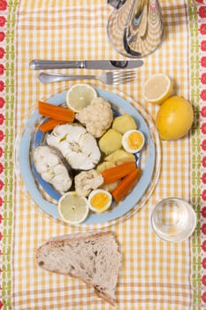 Typical portuguese meal with hake fish with cauliflower, carrots and potatoes.