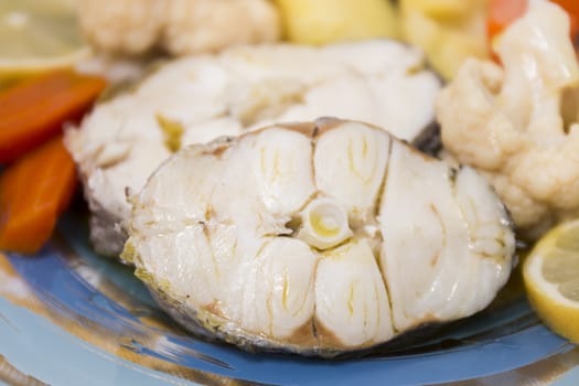 Typical portuguese meal with hake fish with cauliflower, carrots and potatoes.