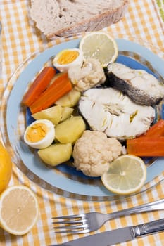 Typical portuguese meal with hake fish with cauliflower, carrots and potatoes.