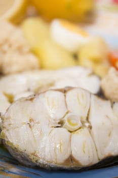 Typical portuguese meal with hake fish with cauliflower, carrots and potatoes.