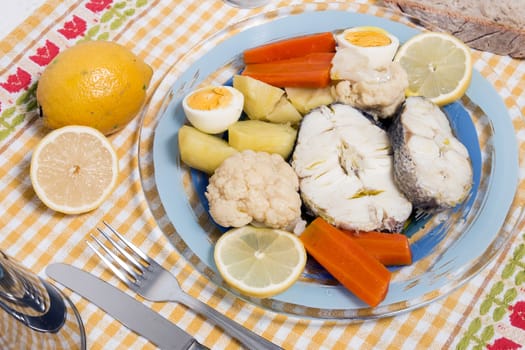 Typical portuguese meal with hake fish with cauliflower, carrots and potatoes.