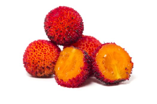 Close up view of strawberry tree (Arbutus Unedo) fruit isolated in white background.