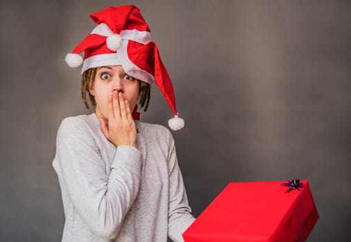 surprised young caucasian woman with tree christmas hats