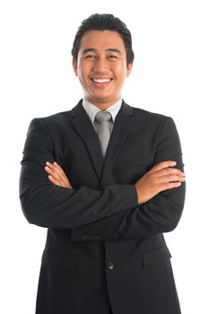 Portrait of handsome young Southeast Asian businessman arms crossed standing isolated on white background. Asian Malay male model.