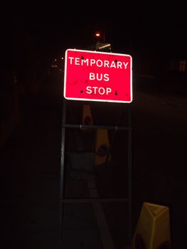 red road sign at night temporary bus stop; essex; england; uk