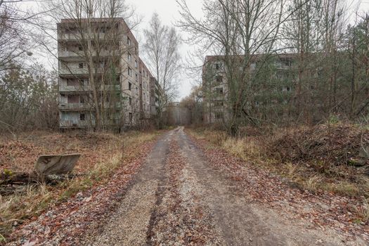 Abandoned buildings in overgrown ghost city Pripyat near Chernobyl nuclear power plant in Ukraine.