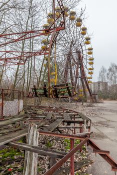 Attraction in amusement park in overgrown ghost city Pripyat near Chernobyl nuclear power plant in Ukraine.