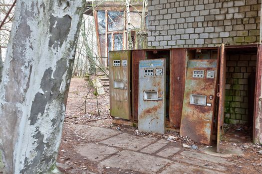 Broken rusty refreshments drinks machines in ghost city Pripyat near Chernobyl nuclear power plant in Ukraine.