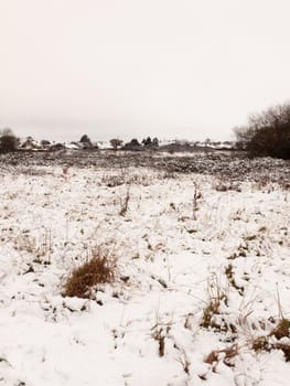 snow covered outside field meadow winter december landscape nature white sky space empty; essex; england; uk