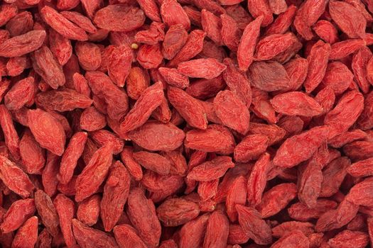 Dried Goji Berries. Background of red ripe goji berries.