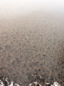 frozen over lake water surface outside winter december; essex; england; uk