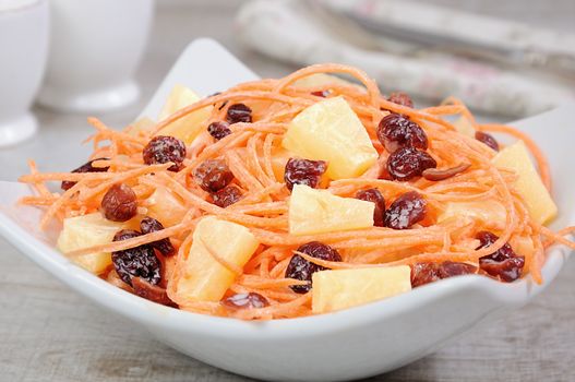 a salad of pineapple, fresh carrots, dried cranberries, yogurt dressed. Gluten free  vegan .