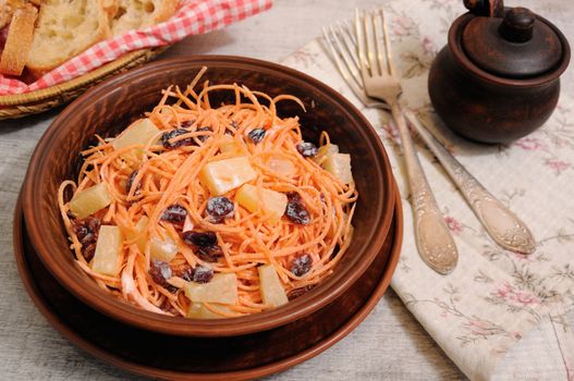 a salad of pineapple, fresh carrots, dried cranberries, yogurt dressed. Gluten free  vegan .