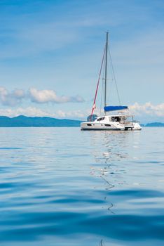 view of the pleasure yacht in the beautiful bay of Thailand, vertical photo