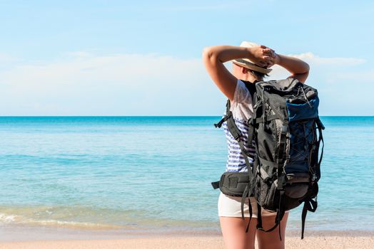 tired tourist with a backpack near the sea enjoying the views