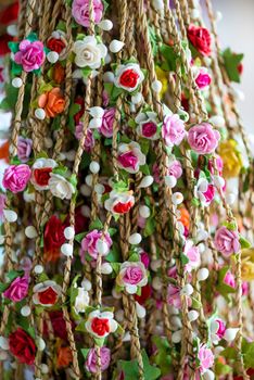 garlands of beautiful flowers for hairstyles in the bazaar close up