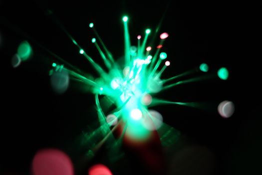 Colorful light explosion on black background. Futuristic wallpaper