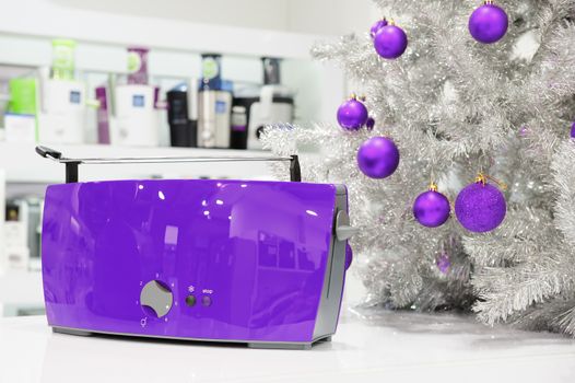 Ultraviolet colored kettle and toasters in appliances store at Christmas