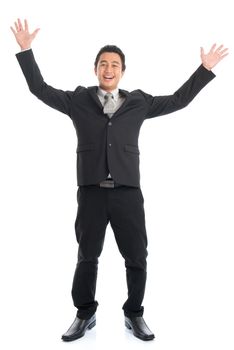 Full body front view attractive young Southeast Asian businessman arms raised and jumping, isolated on white background. 