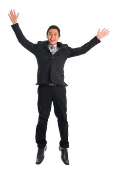 Full body attractive young Southeast Asian businessman jumping, isolated on white background. Asian malay male model.