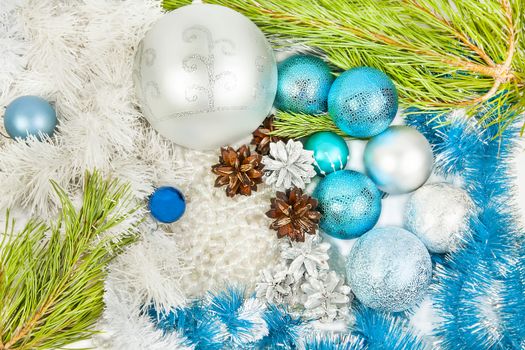 New year and Christmas blue and white decorations and fir tree branch