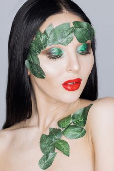 Fashion Art Portrait .Green Make-up and Colorful Bright Nails.