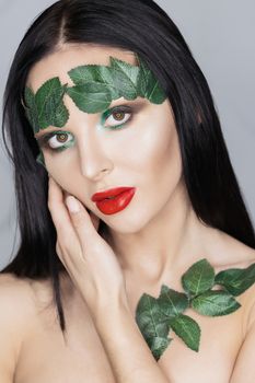 Fashion Art Portrait .Green Make-up and Colorful Bright Nails.