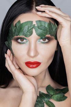 Fashion Art Portrait .Green Make-up and Colorful Bright Nails.