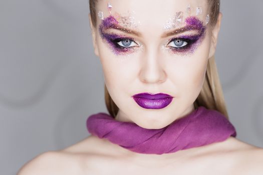 Beauty Makeup. Purple Make-up and Colorful Bright Nails. Beautiful Girl Close-up Portrait.