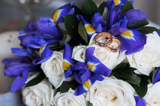 Beautiful wedding bouquet and rings. Wedding day.