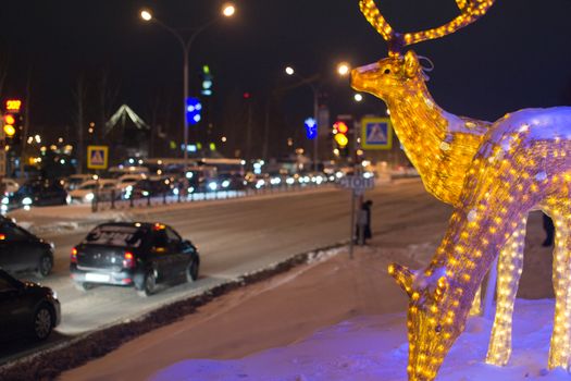 the deer in the lights of the evening and the city