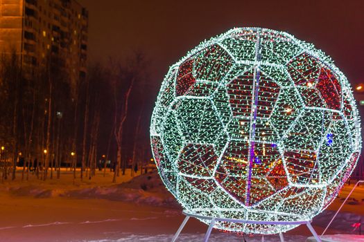 soccer ball and foot of the lights the evening football