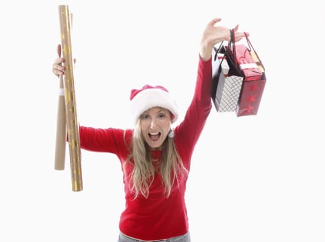 /a woman holding Christmas gifts bought at the shop and gold and kraft wrapping paper