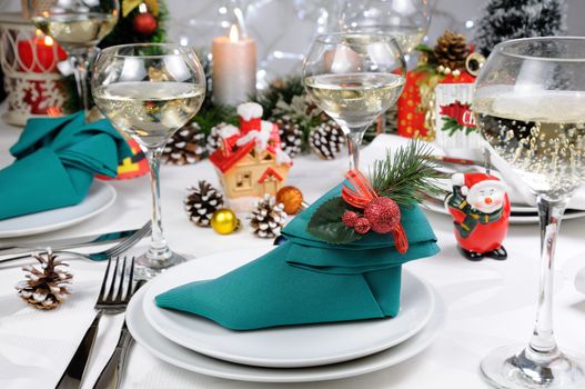 Napkin folded in the form of an Elven boot decorated on the Christmas table