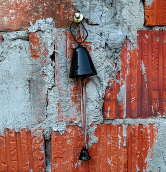Old bell used on cattle, hanging on wall