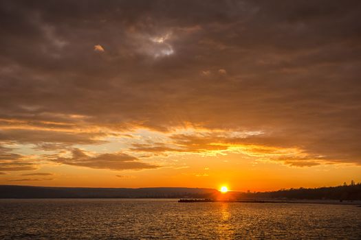 Amazing sunset over the sea bay