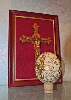 Engraving wooden cross, and decorated easter egg