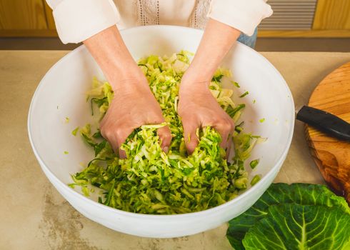 Preparing fermented preserved vegetables. Cabbage kimchi and sauerkraut sour cabbage. 