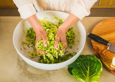 Preparing fermented preserved vegetables. Cabbage kimchi and sauerkraut sour cabbage. 